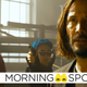 Keanu Reeves' Neo looks on, as Bugs and Morpheus stand ready to fight in the background.